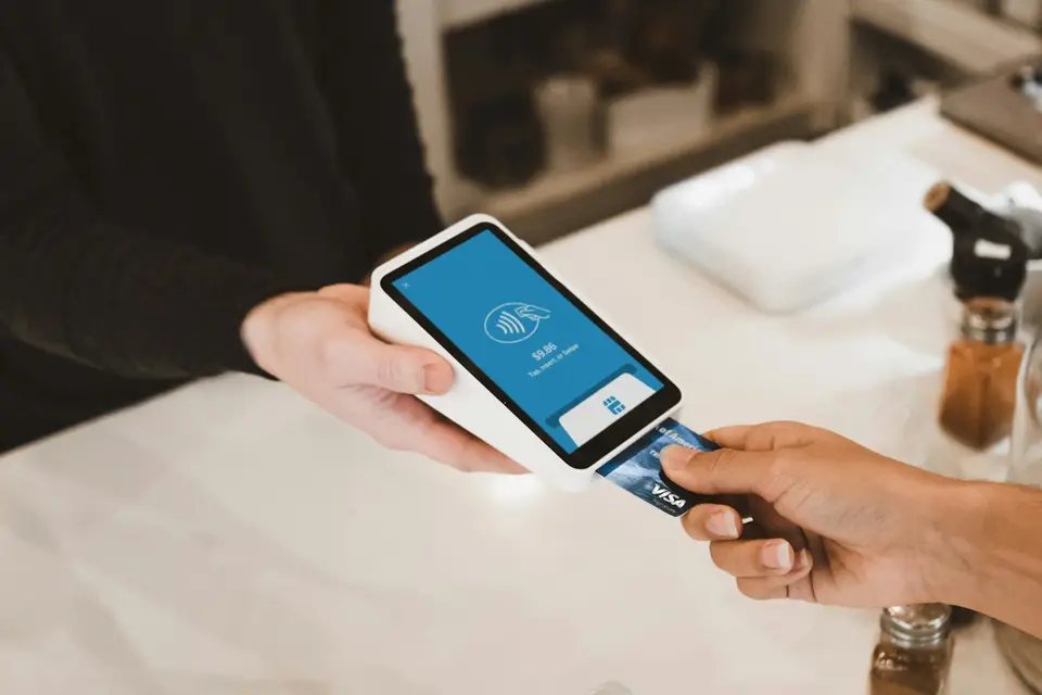 Card being inserted into a payment terminal