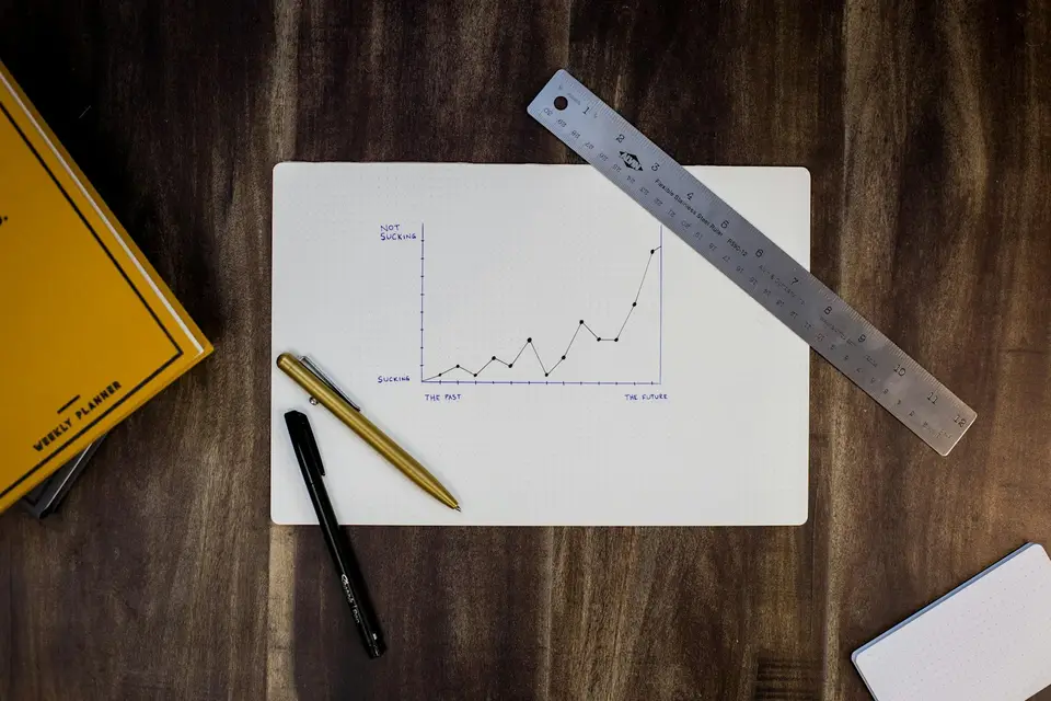 Hand-drawn line chart on paper