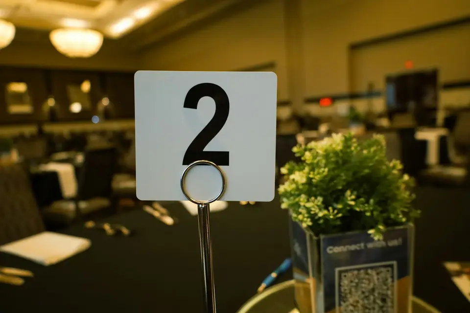 Close-up of a table with a number card