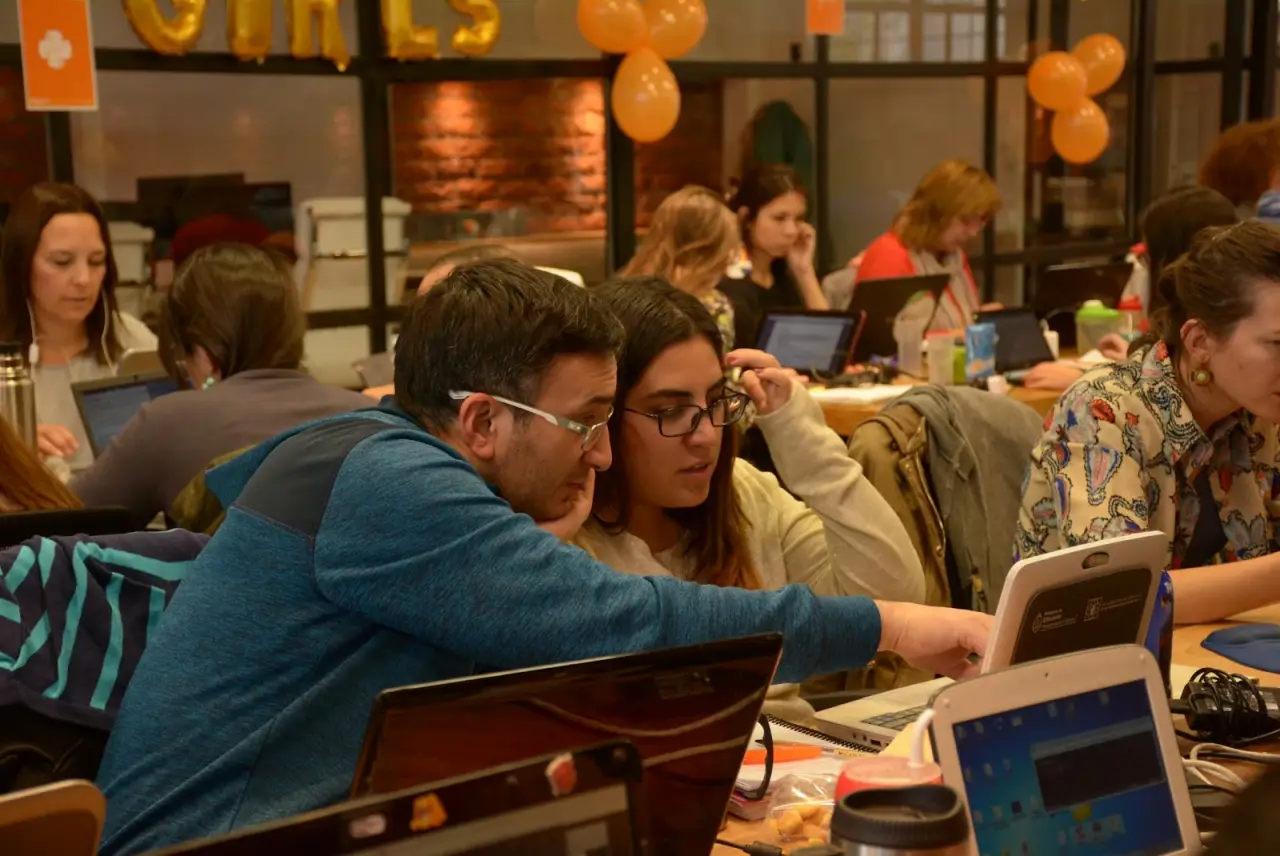 Learning together and answering questions at a laptop