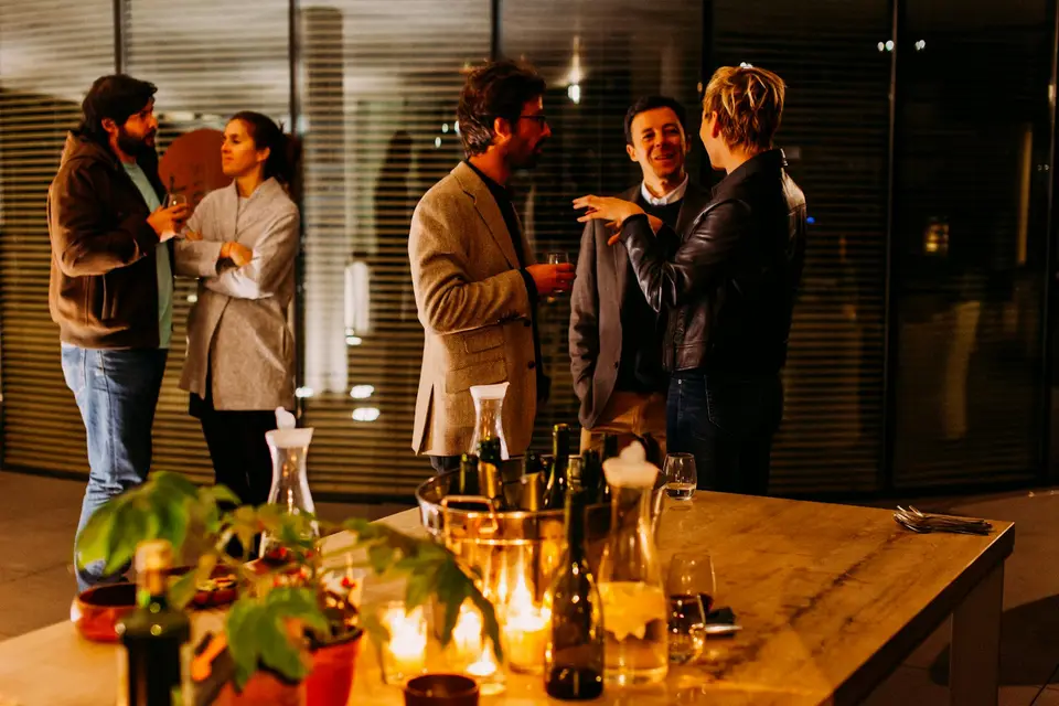 Five professionals standing and talking