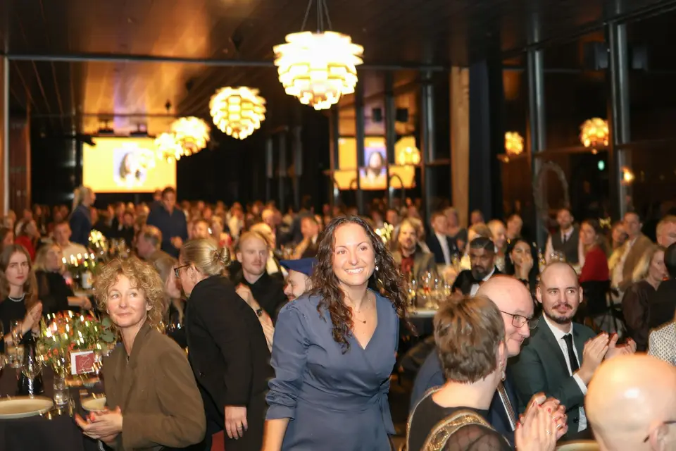 Woman smiling at a formal evening gathering
