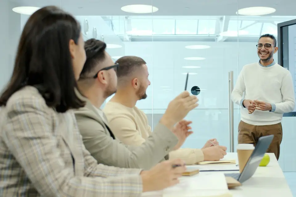 Man presenting to colleagues in a modern office