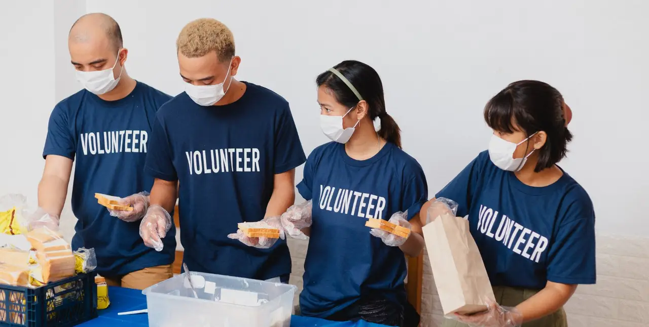 Volunteers helping distribute food.