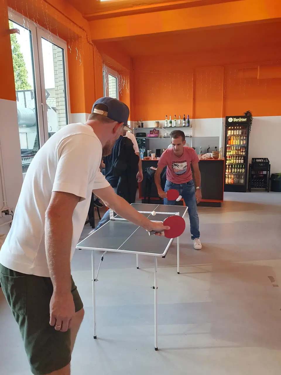 Two campai colleagues playing table tennis